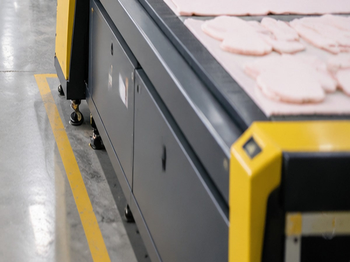 Laser cutter cutting fabric pattern pieces